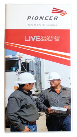 Pioneer Energy Services custom tally book with a full color photo of two oilfield workers on the cover